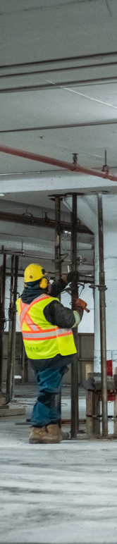 picture of worker adjusting shoring posts